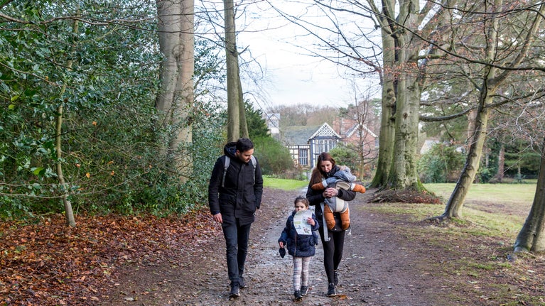 Family exploring Rufford's grounds in winter